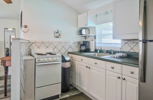 Madeira Beach Cottage | Private Cottage with Private Patio. Heated Pool. Cross Street to Beach. Walk to Food & Activities.