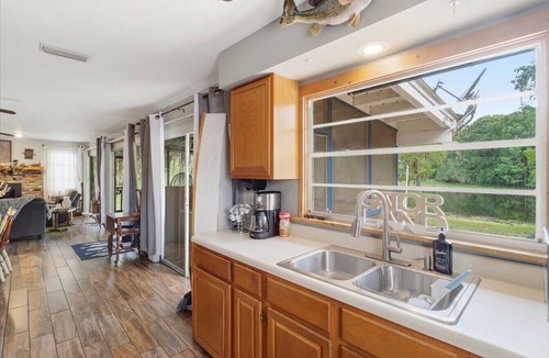 Bushnell Cabin | Riverfront Cabin w Screened Patio & Fire Pit!