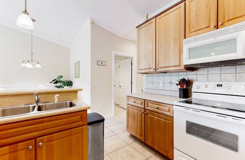 Sunset Beach Condo | SB61 Sunset Serenity: Sunny condo with a pool, balcony, kitchen, beach gear, W/D, & AC