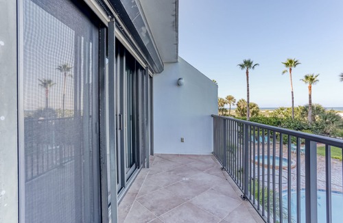 Sand Key House | Second-floor condo with pool and tennis court, private W/D, and central AC