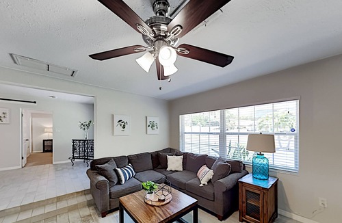 Harbor Bluffs House | Single-story home with outdoor dining, firepit, home office & laundry room