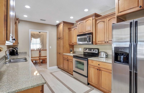 Harbor Hills House | Snowbird-friendly elegant home with waterfront location, pool, grill, fireplace