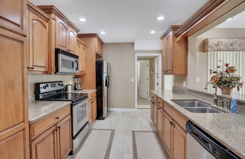 Harbor Hills House | Snowbird friendly elegant home with waterfront location pool grill fireplace
