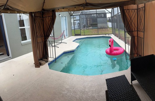 Tuscan Ridge House | Spacious 4-bedroom Pool house with WiFi, AC Minutes From Disney
