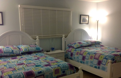 Sea Trail Condo | Spacious, First Floor Corner Unit, brings outdoors in w/ magnificent pond view!