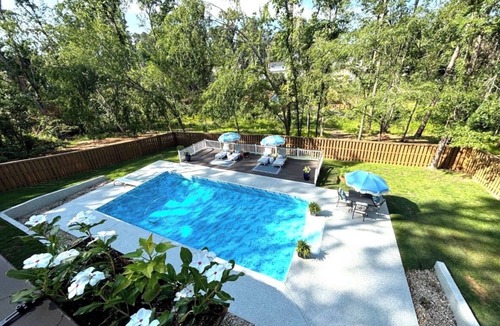 Evans House | Spacious Southern Masters Week Retreat with Pool & Private Wooded Setting