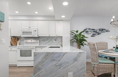 Plantation Condo | SUMMER SALE! Remodeled PGA Golf & Country Club condo on 10th hole!