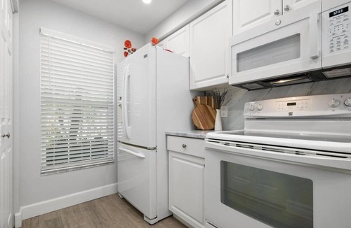 Plantation Condo | SUMMER SALE! Remodeled PGA Golf & Country Club condo on 10th hole!