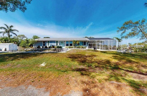 Cortez House | Sunny canal front home with a pool & dock - central location and dogs ok