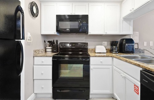 Avon By The Sea Condo | Sunny Condo w/Private Balcony, Heated Pool, and Steps to Beach Access & Pier! ☀️🏖️