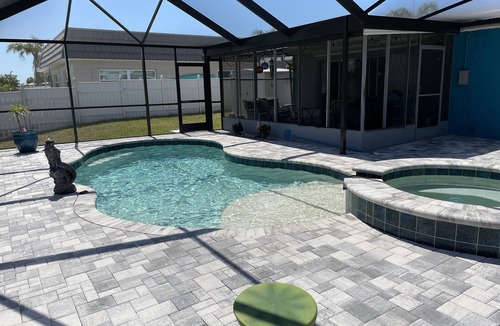 Gulf Harbors House | Sunset Serenity Retreat: Coastal Elegance with Poolside Bliss