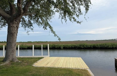 Spring Hill House | Tranquil Canal-Front Home with Direct Gulf Access and Stunning Sunsets