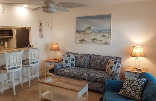 Sunset Beach Condo | Treasure Island Waterfront Condo, Equipped Fishing dock, Steps to Beach, Dining