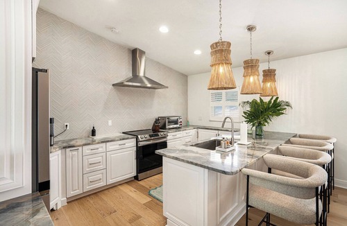 Capri Isle House | TREASURE ISLAND FLORIDA- Discover your luxury 4 bedroom home on canal fishing