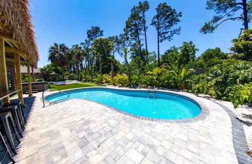 Thomas Drive House | Tropical Oasis, Sleeps 19, 5 Min to Beach, HTD Pool, Mini Golf Hot Tub Game room