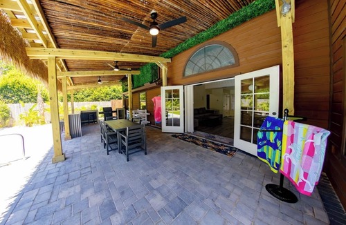Thomas Drive House | Tropical Oasis, Sleeps 19, 5 Min to Beach, HTD Pool, Mini Golf Hot Tub Game room