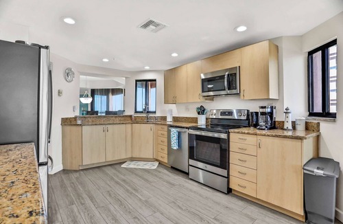 Sand Key Condo | Vibrant ocean view condo with hot tub tennis court pool WD balcony and grill