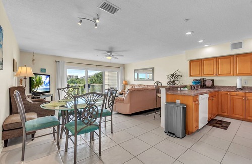 Indian Shores Condo | 🐬Water Views🐶Dogs Welcome🌞Walk to Beach🌴Heated Pool/Fishing Dock
