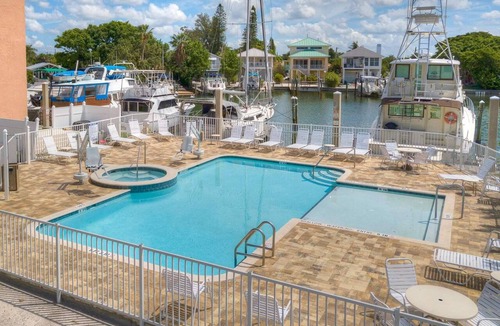 Madeira Beach Condo | Waterfront Top Unit w/Marina. Across from the Beach. Spacious w/2 Private Balconies, Pool & Hot Tub