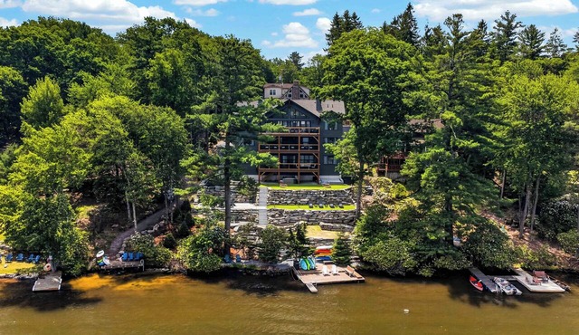 An Elevated Group Retreat with Soaring Glass, Lake Views, Boats, 3 Decks