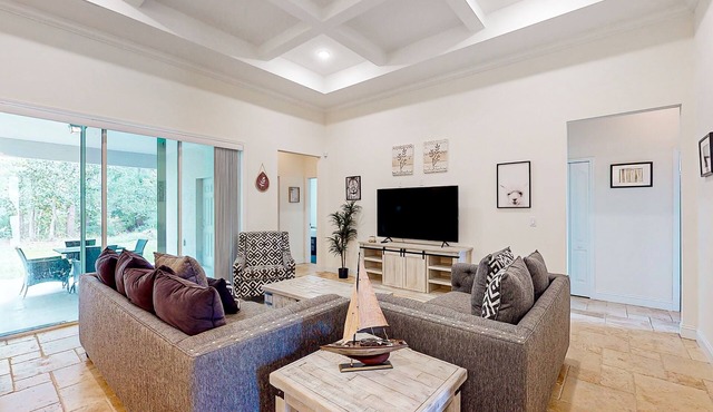 Dog-friendly home with Tesla EV charger, yard, patio, grill, AC, & W/D
