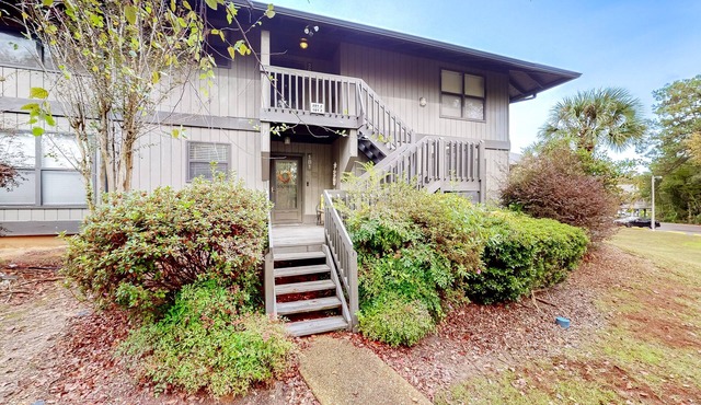 First-floor updated condo with pool, tennis court, balcony, & AC - dog-friendly