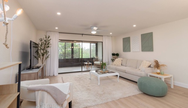 LAKE VIEWS! GORGEOUSLY UPDATED! 1700 total sqft with OVERSIZED LANAI!