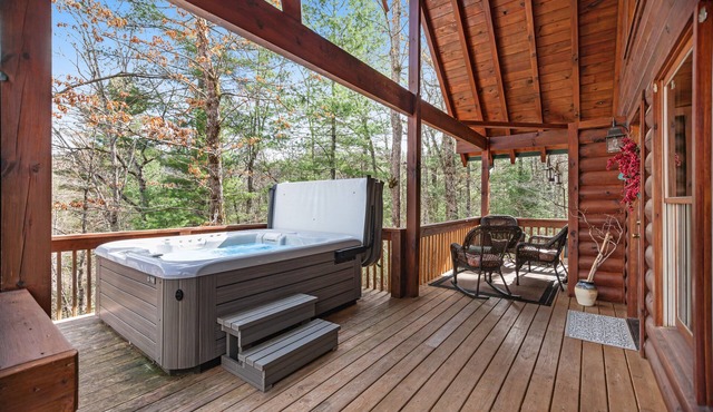 Mountain cabin with private hot tub, covered deck & incredible view