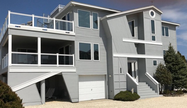 Newly Renovated Bay Front! Great views, beautiful heated pool. Private dock