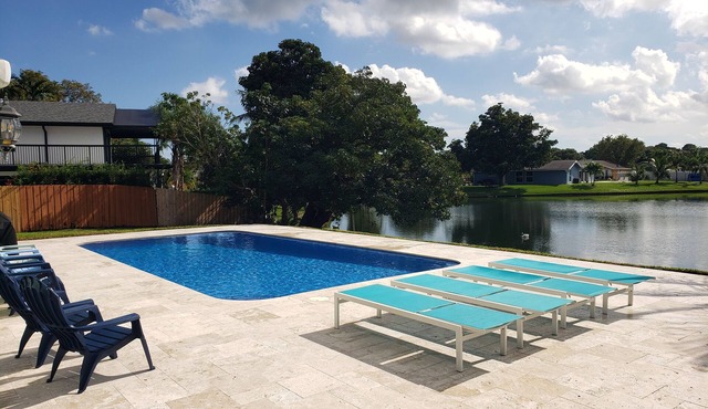 Spacious Modern Waterfront Lake Home with Heated Pool/15 min Drive to Beach!