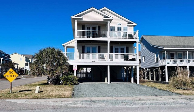 Stay at Wolfpack Waves, a spacious 4BR home in Holden Beach, perfect for 10 guests!