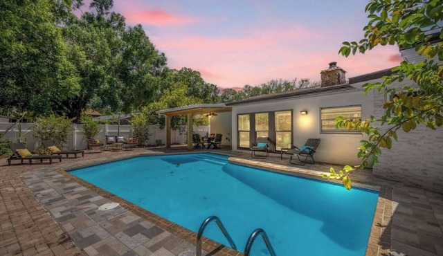 This tropical spacious pool house screams modern luxury