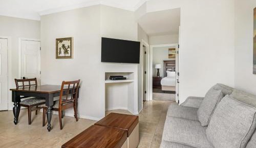Two-Bedroom Deluxe Suite with One King Bed, Two Double Beds and Balcony