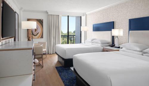 Queen Guest Room with Two Queen Beds and Partial Gulf View - Balcony